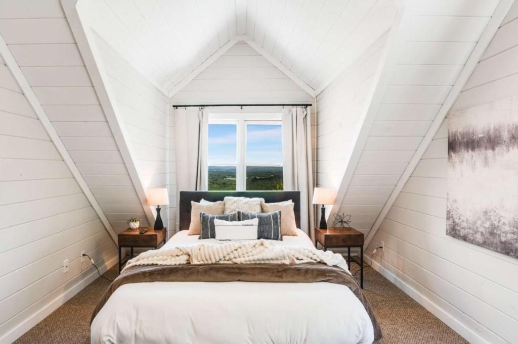 231 Sunrock Mountain Trail Blue Ridge, GA 30513 - Photo 38 of 61 a bedroom with a bed and a large window