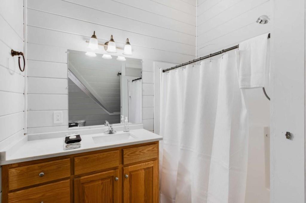 231 Sunrock Mountain Trail Blue Ridge, GA 30513 - Photo 40 of 61 a bathroom with a sink and a mirror