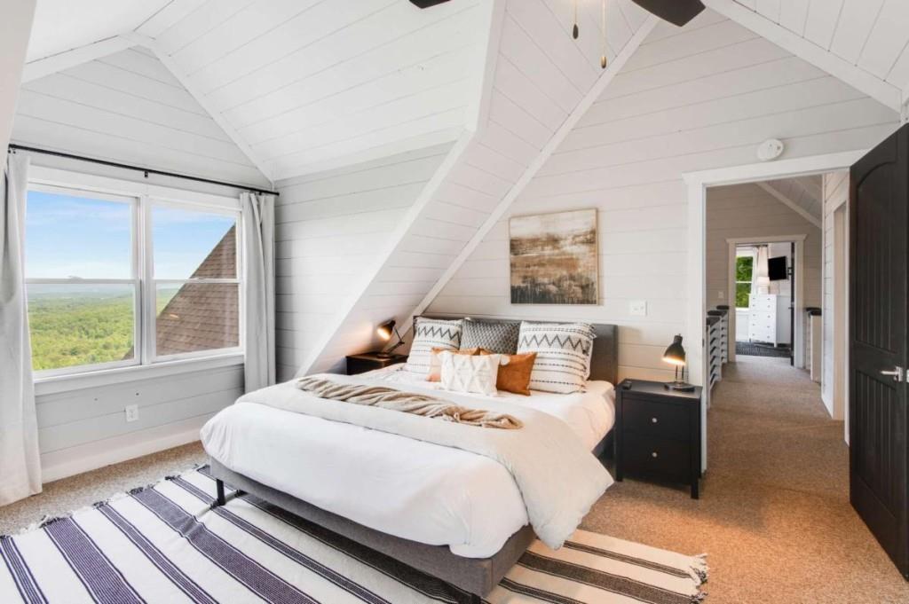 231 Sunrock Mountain Trail Blue Ridge, GA 30513 - Photo 41 of 61 a bedroom with a bed and wooden floor