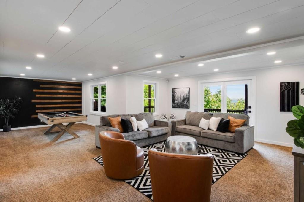 231 Sunrock Mountain Trail Blue Ridge, GA 30513 - Photo 46 of 61 a living room with furniture a air conditioner and a flat screen tv
