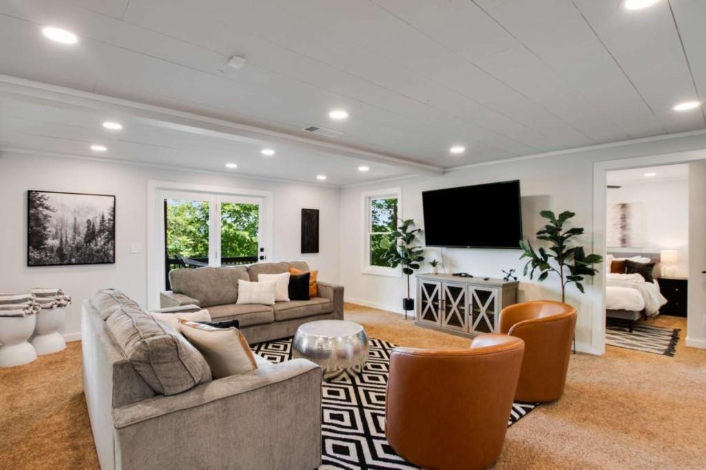 231 Sunrock Mountain Trail Blue Ridge, GA 30513 - Photo 48 of 61 a living room with furniture and a flat screen tv