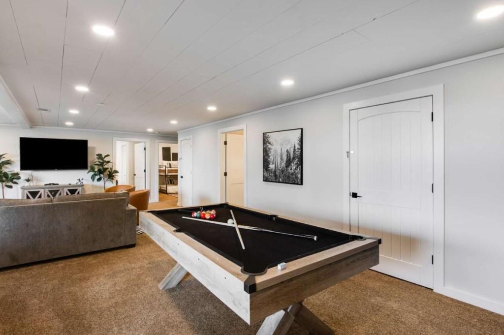 231 Sunrock Mountain Trail Blue Ridge, GA 30513 - Photo 51 of 61 a living room with furniture and a flat screen tv