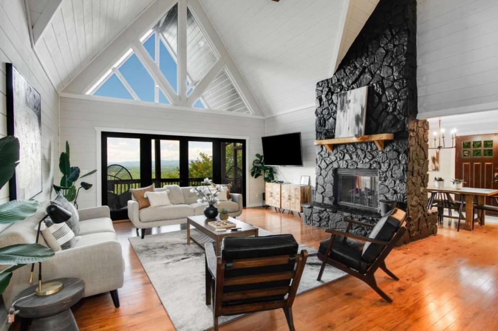 231 Sunrock Mountain Trail Blue Ridge, GA 30513 - Photo 8 of 61 a living room with furniture fireplace and flat screen tv