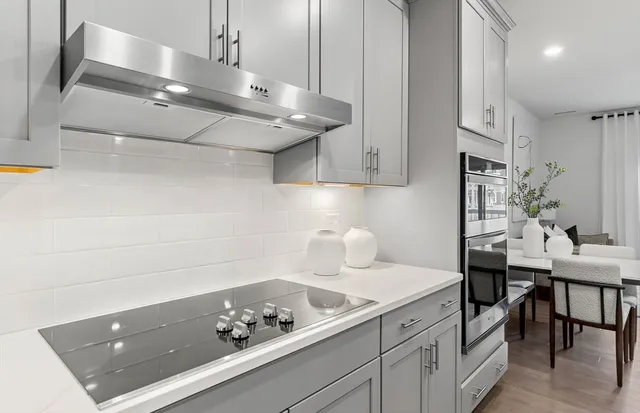 a kitchen with a sink and cabinets