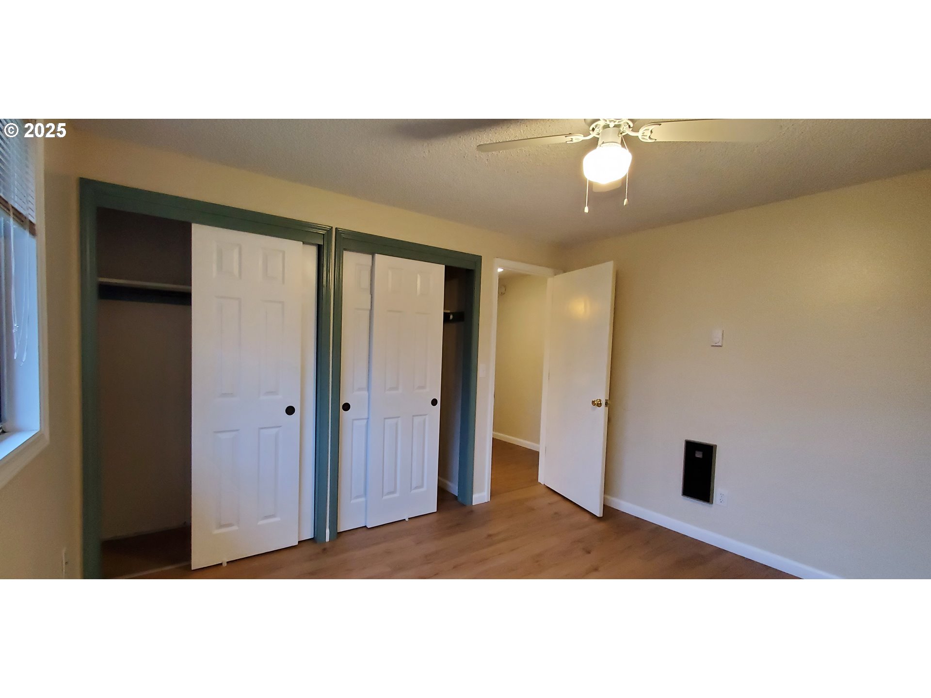 101 Ash Street Ridgefield, WA 98642 - Photo 11 of 15 a picture of a room with a large window and chandelier fan