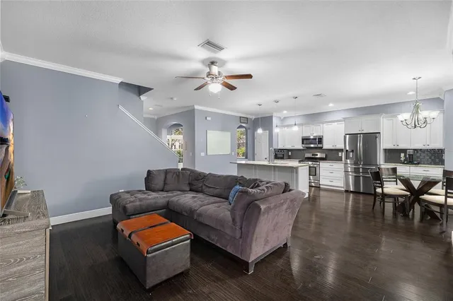 a kitchen with a sink stainless steel appliances and cabinets