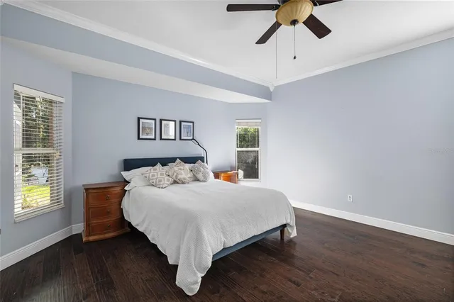 a bathroom with a granite countertop sink mirror and a bathtub