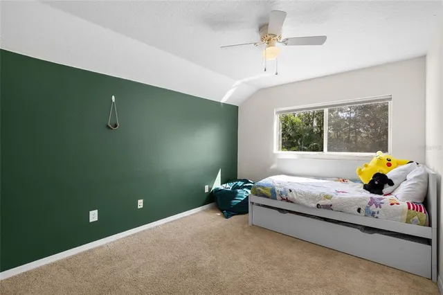 a view of a chair and table in the garden