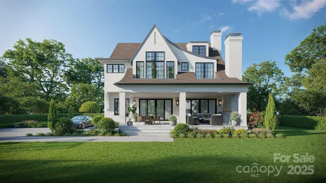 a front view of a house with a garden and plants