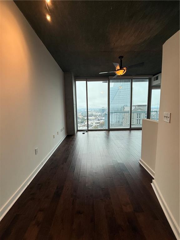3324 Peachtree Road Northeast, Unit 2406 Atlanta, GA 30326 - Photo 3 of 12 wooden floor in an empty room with a window
