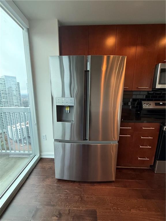 3324 Peachtree Road Northeast, Unit 2406 Atlanta, GA 30326 - Photo 5 of 12 a view of a refrigerator in kitchen and wooden floor