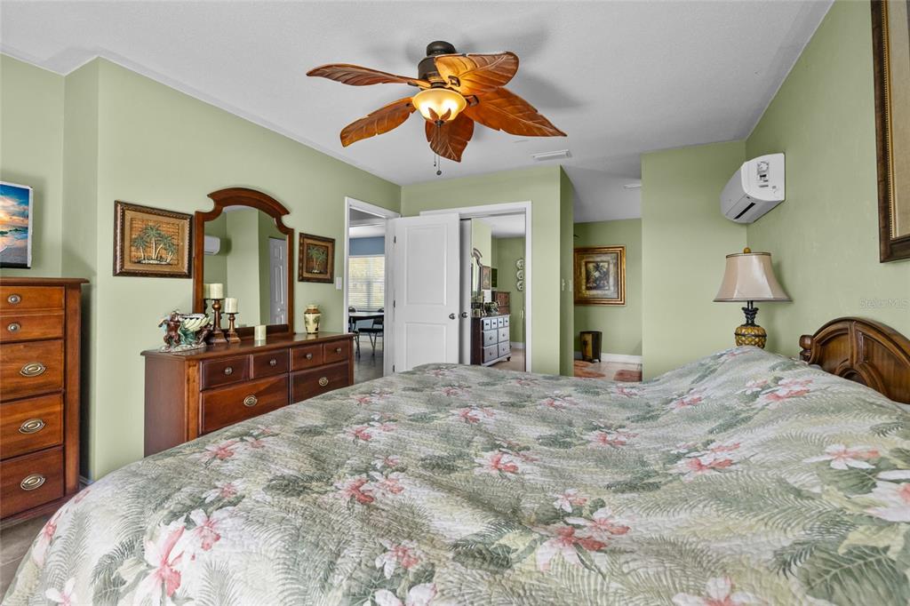 6417 Baker Road Keystone Heights, FL 32656 - Photo 12 of 32 a bedroom with a bed and a dresser