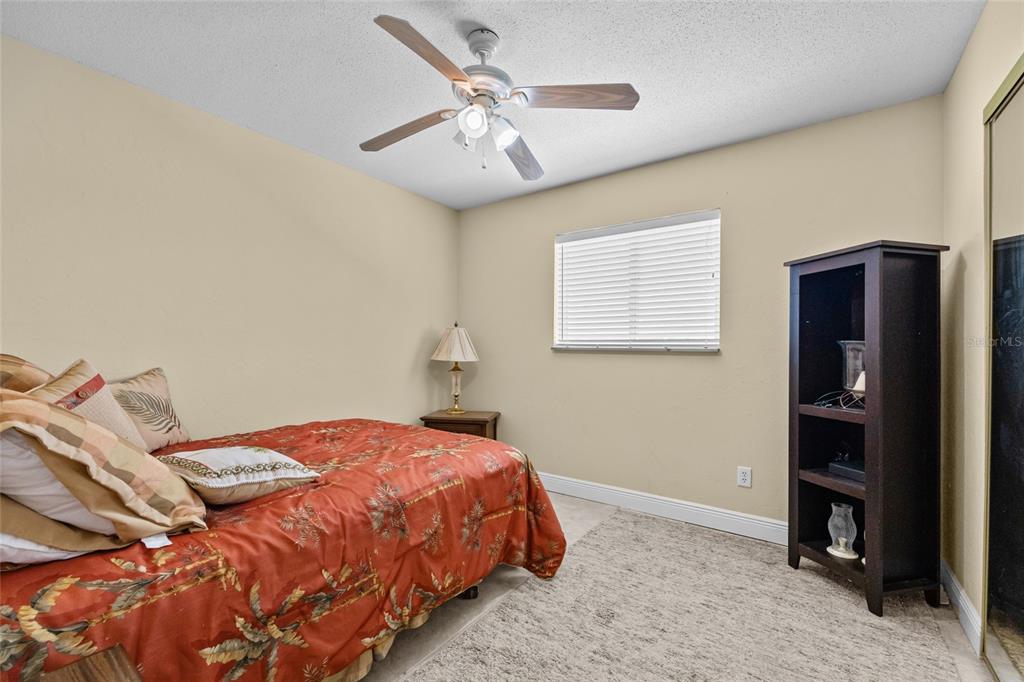 6417 Baker Road Keystone Heights, FL 32656 - Photo 18 of 32 a bedroom with a bed and a cabinets