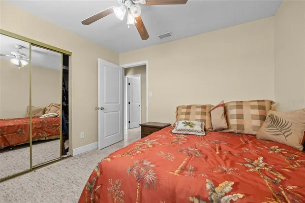 a bedroom with a bed and balcony