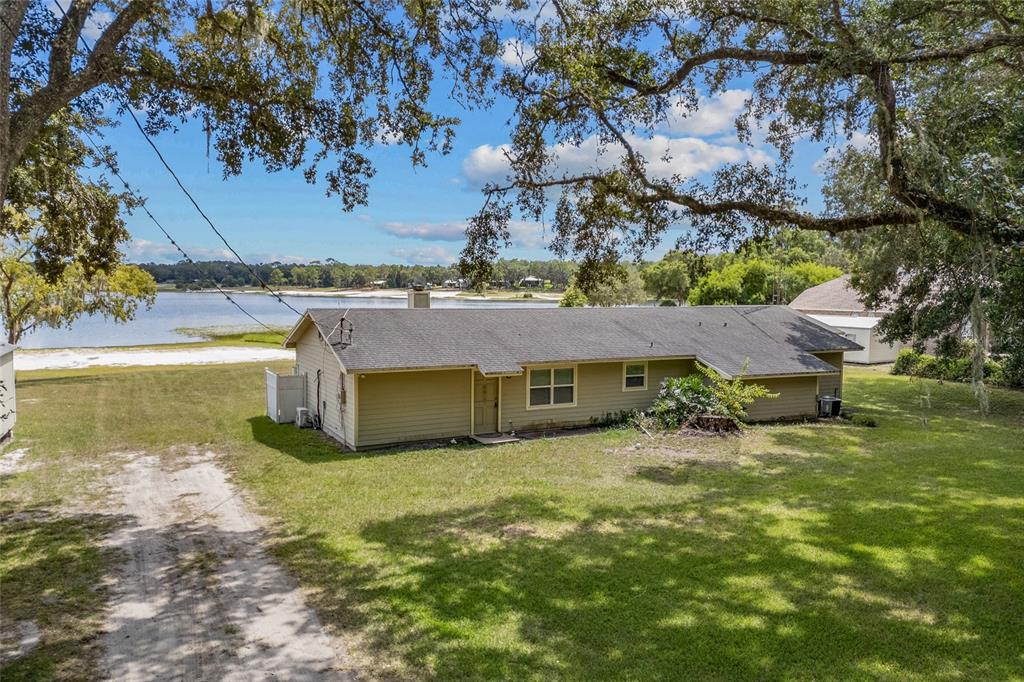 6417 Baker Road Keystone Heights, FL 32656 - Photo 26 of 32 a view of a house with a yard