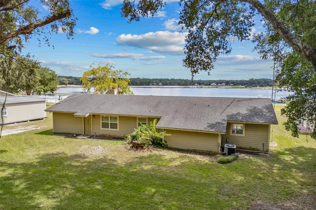 6417 Baker Road Keystone Heights, FL 32656 - Photo 27 of 32 an aerial view of a house with a yard basket ball court and outdoor seating
