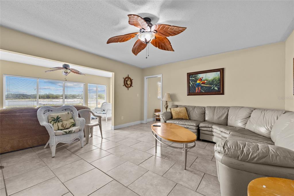 6417 Baker Road Keystone Heights, FL 32656 - Photo 9 of 32 a living room with furniture and a large window