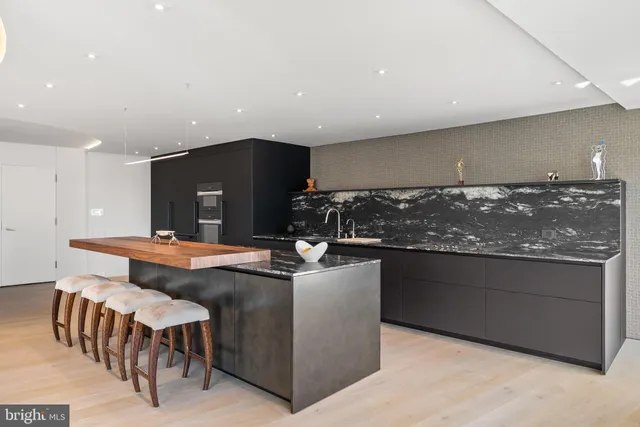 a bedroom with a bed and glass door