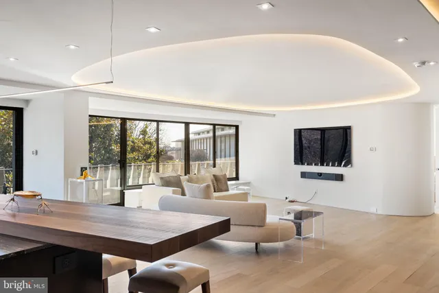 a spacious bedroom with a large bed and a large window