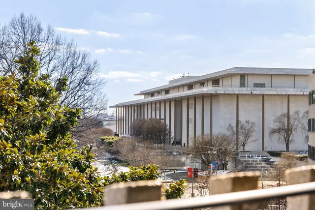 a bedroom with a large bed and a couch