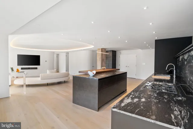 a living room with a couch and a large window