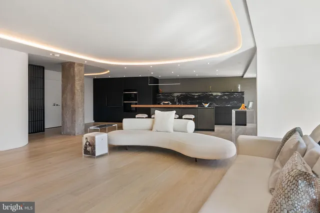 a large bed sitting in a bedroom next to a large window