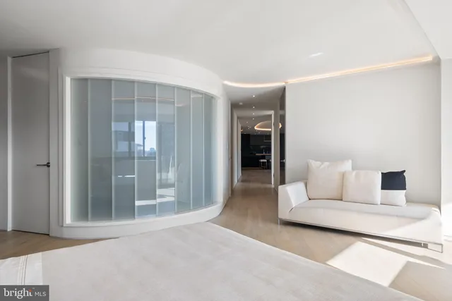 a balcony with furniture and a potted plant