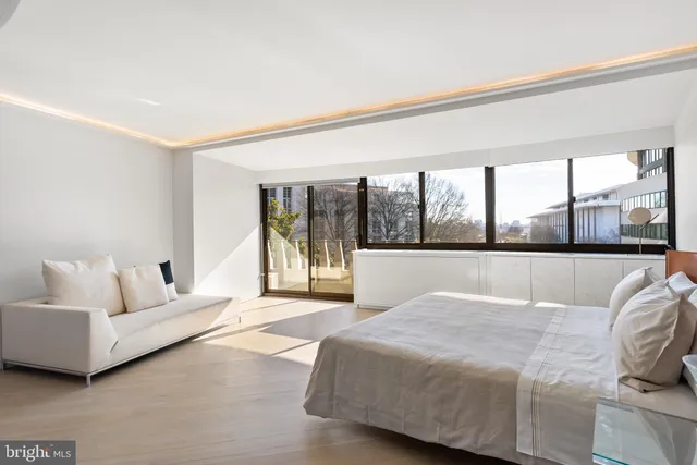 a room with granite countertop a sink and a wooden floor