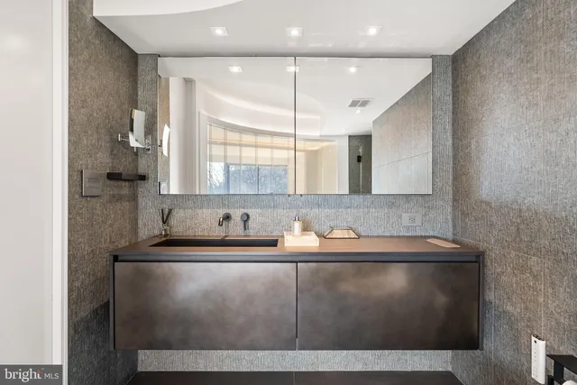 a view of a hallway with washer and dryer