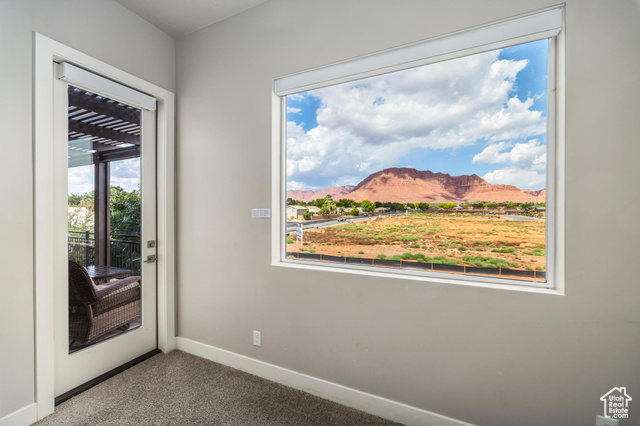 2600 Ocotillo Way, Unit 34 Santa Clara, UT 84765 - Photo 31 of 43 Doorway with a mountain view and carpet flooring