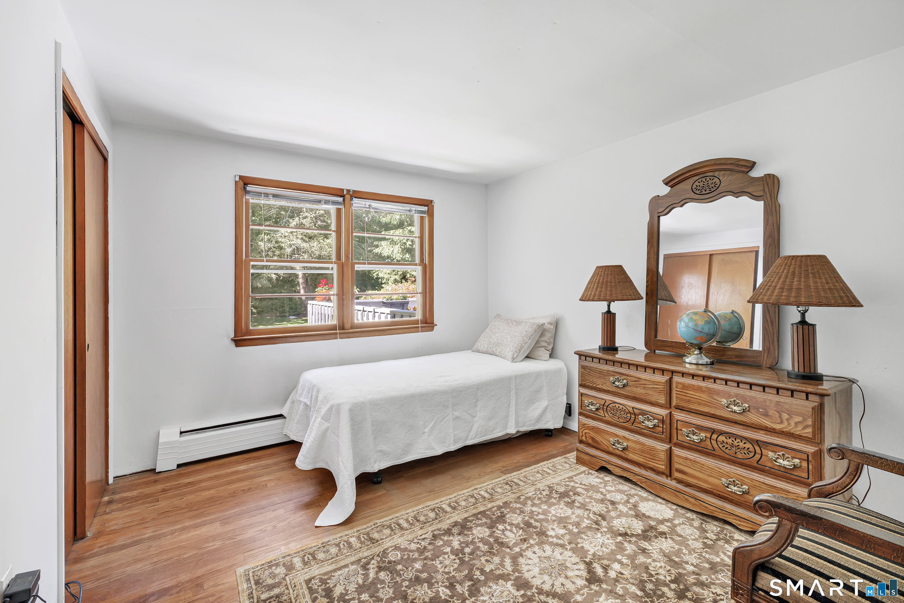223 Wheeler Road Monroe, CT 06468 - Photo 20 of 35 a bedroom with a bed and a window