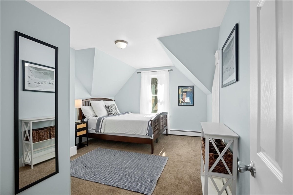 126 Beaconsfield Road Worcester, MA 01602 - Photo 21 of 42 a bed room with a bed and a window