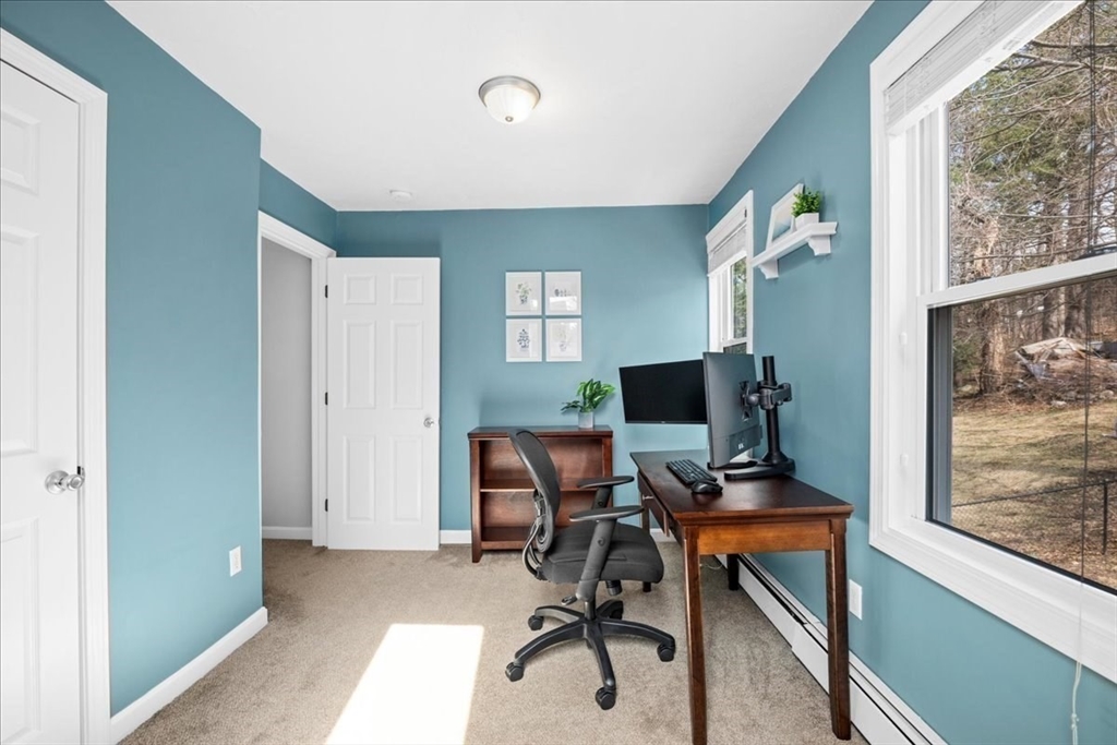 126 Beaconsfield Road Worcester, MA 01602 - Photo 23 of 42 a view of a workspace with furniture and a window
