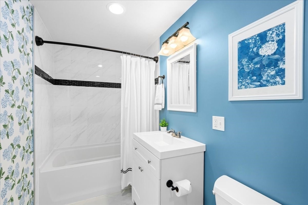 126 Beaconsfield Road Worcester, MA 01602 - Photo 26 of 42 a bathroom with a sink and a mirror