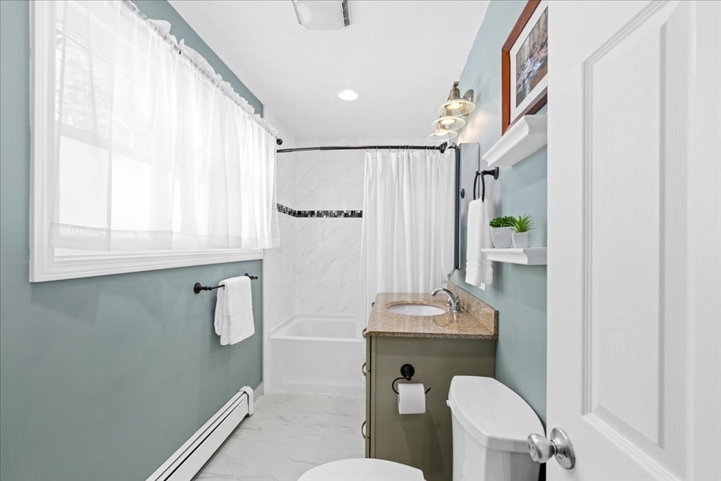 126 Beaconsfield Road Worcester, MA 01602 - Photo 27 of 42 a bathroom with a sink mirror toilet and bathtub