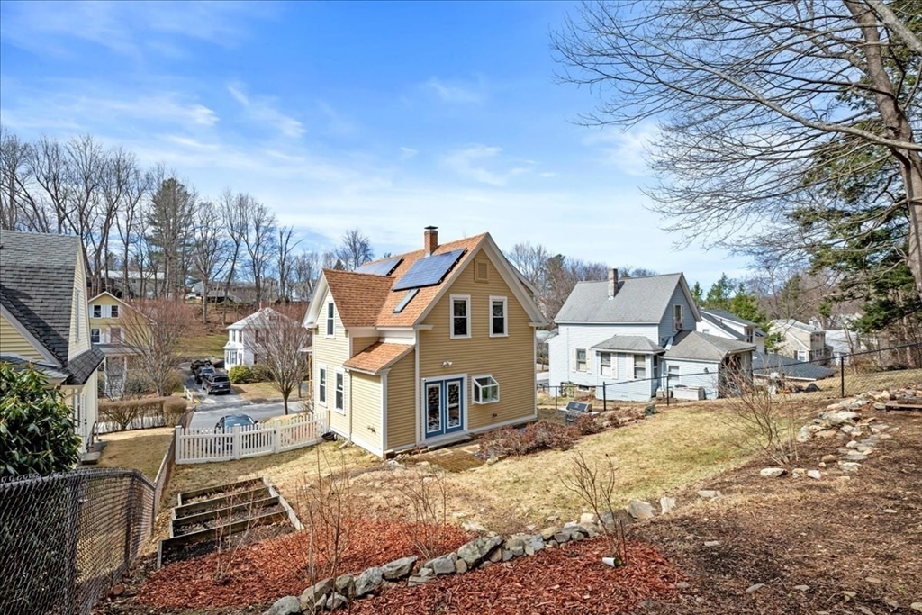 126 Beaconsfield Road Worcester, MA 01602 - Photo 32 of 42 a front view of a house with a yard covered in snow