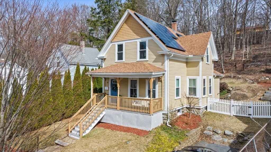 126 Beaconsfield Road Worcester, MA 01602 - Photo 4 of 42 a view of a house with wooden floor and a yard