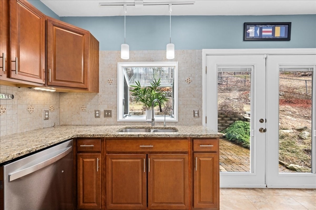 126 Beaconsfield Road Worcester, MA 01602 - Photo 7 of 42 a kitchen with granite countertop stainless steel appliances a sink and cabinets