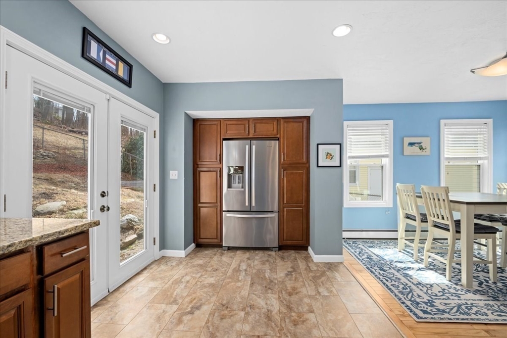 126 Beaconsfield Road Worcester, MA 01602 - Photo 8 of 42 a kitchen with stainless steel appliances granite countertop a refrigerator and stove