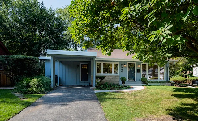 a front view of house with yard and green space