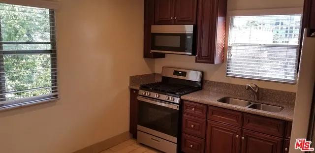 a kitchen with a stove and a microwave