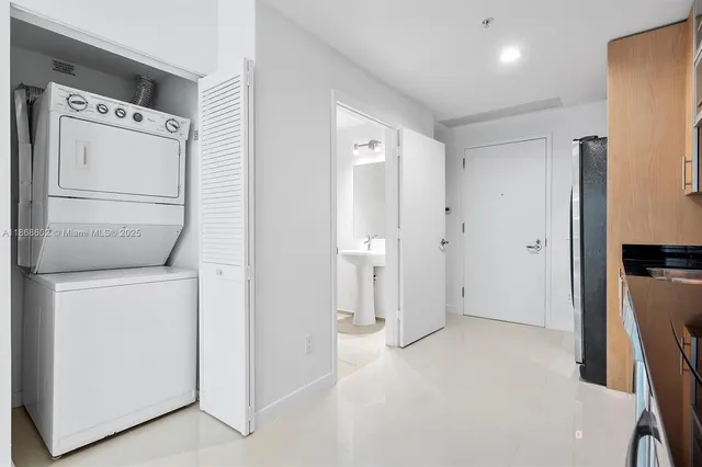 a white toilet sitting next to a shower