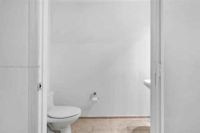 a view of staircase with white walls