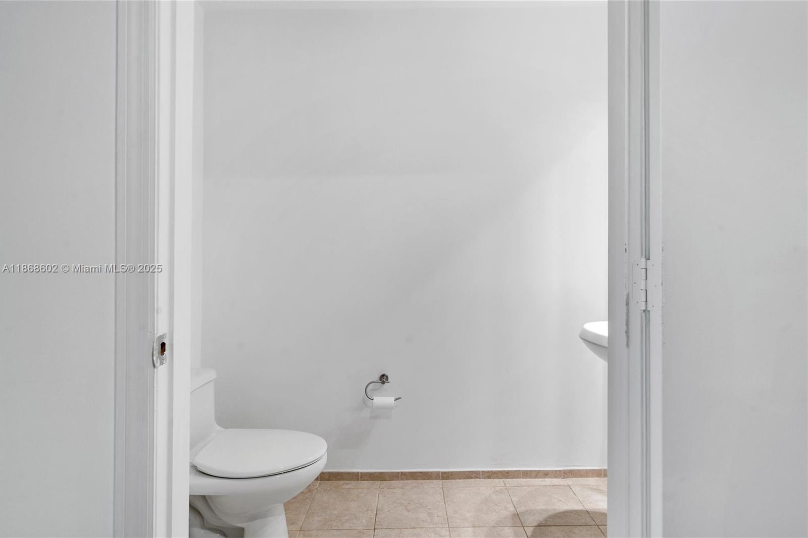 60 Southwest 13th Street, Unit 2420 Miami, FL 33130 - Photo 13 of 33 a white toilet sitting next to a shower