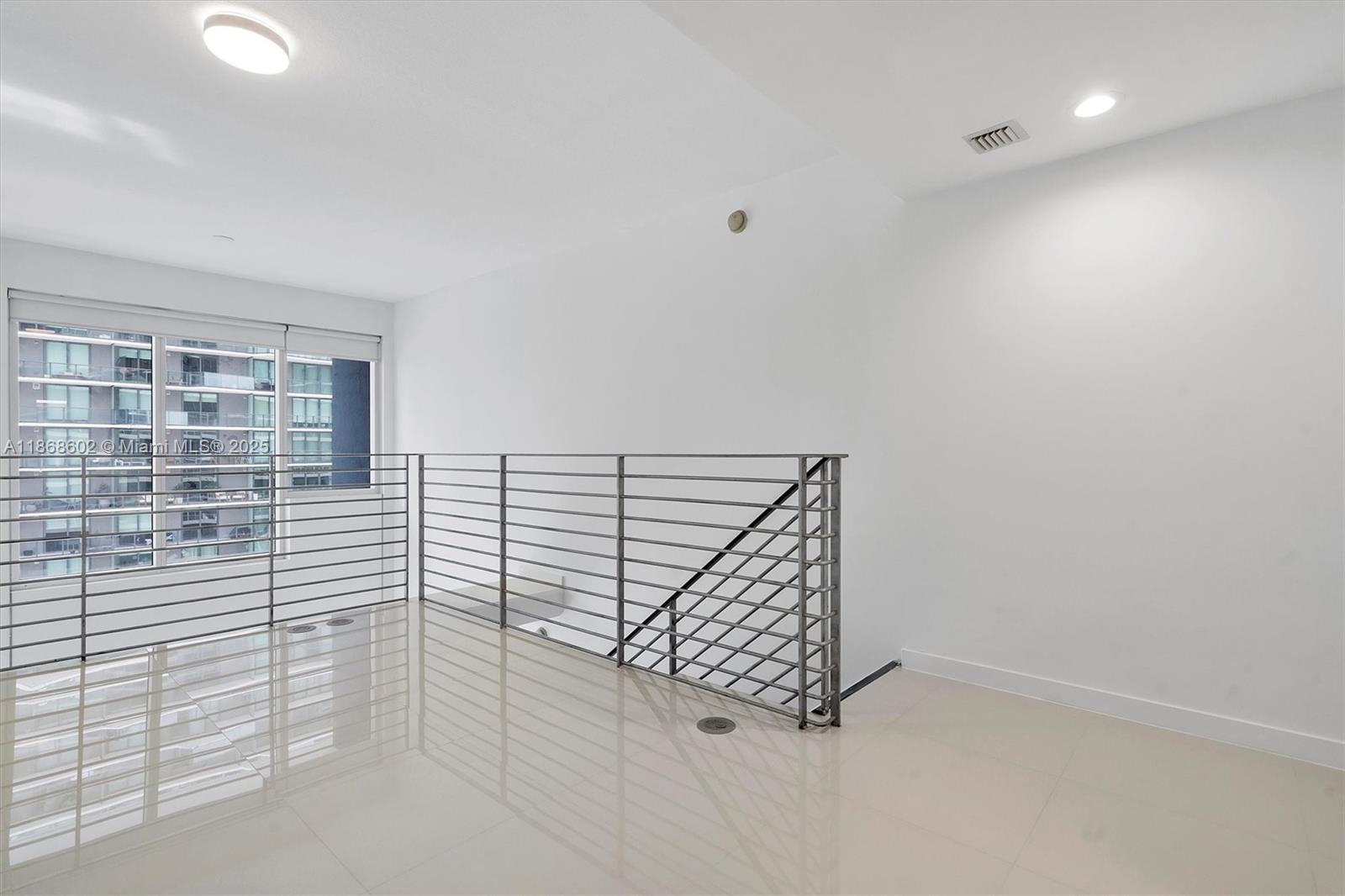 60 Southwest 13th Street, Unit 2420 Miami, FL 33130 - Photo 15 of 33 a view of staircase with white walls
