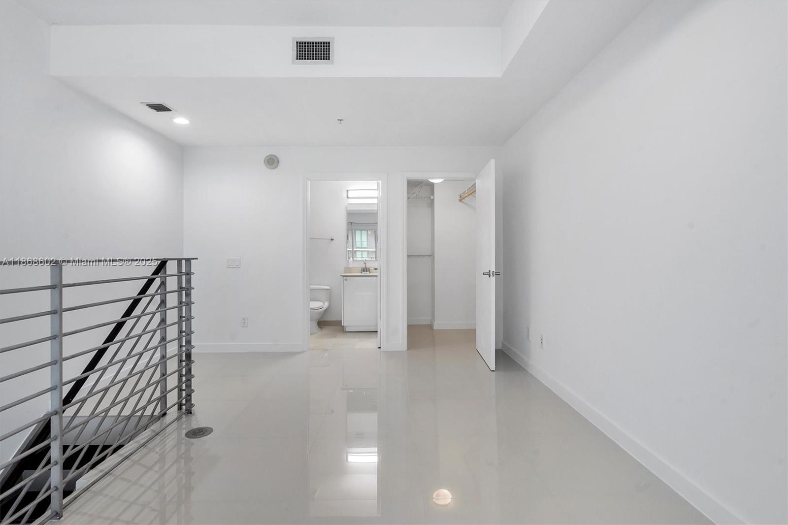 60 Southwest 13th Street, Unit 2420 Miami, FL 33130 - Photo 17 of 33 wooden floor in an empty room with a bathroom