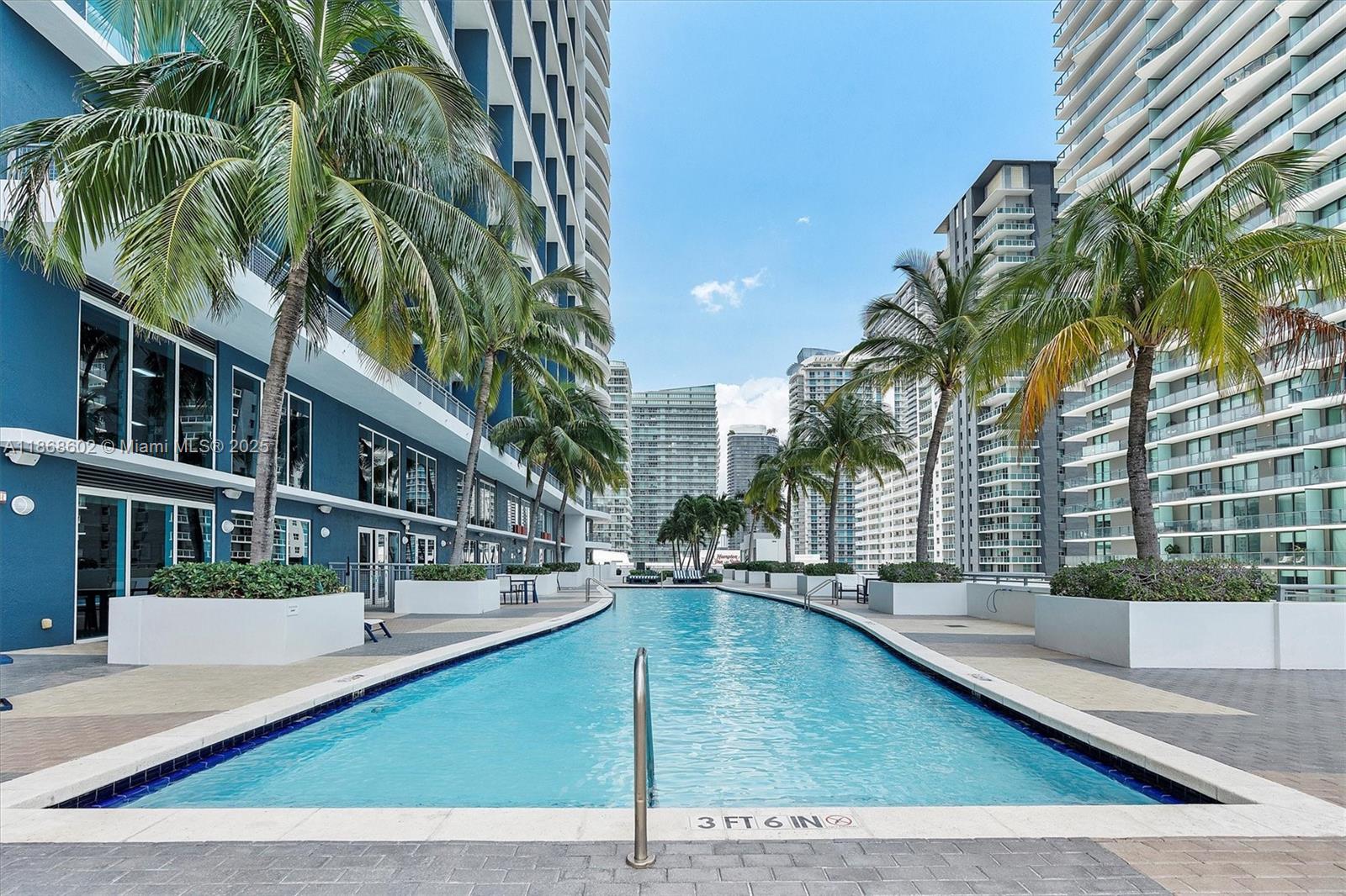 60 Southwest 13th Street, Unit 2420 Miami, FL 33130 - Photo 25 of 33 a view of a swimming pool with a patio