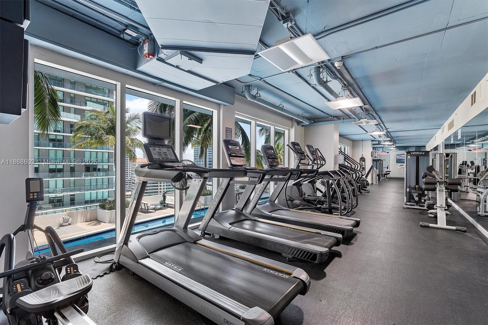 60 Southwest 13th Street, Unit 2420 Miami, FL 33130 - Photo 27 of 33 a view of a room with gym equipment