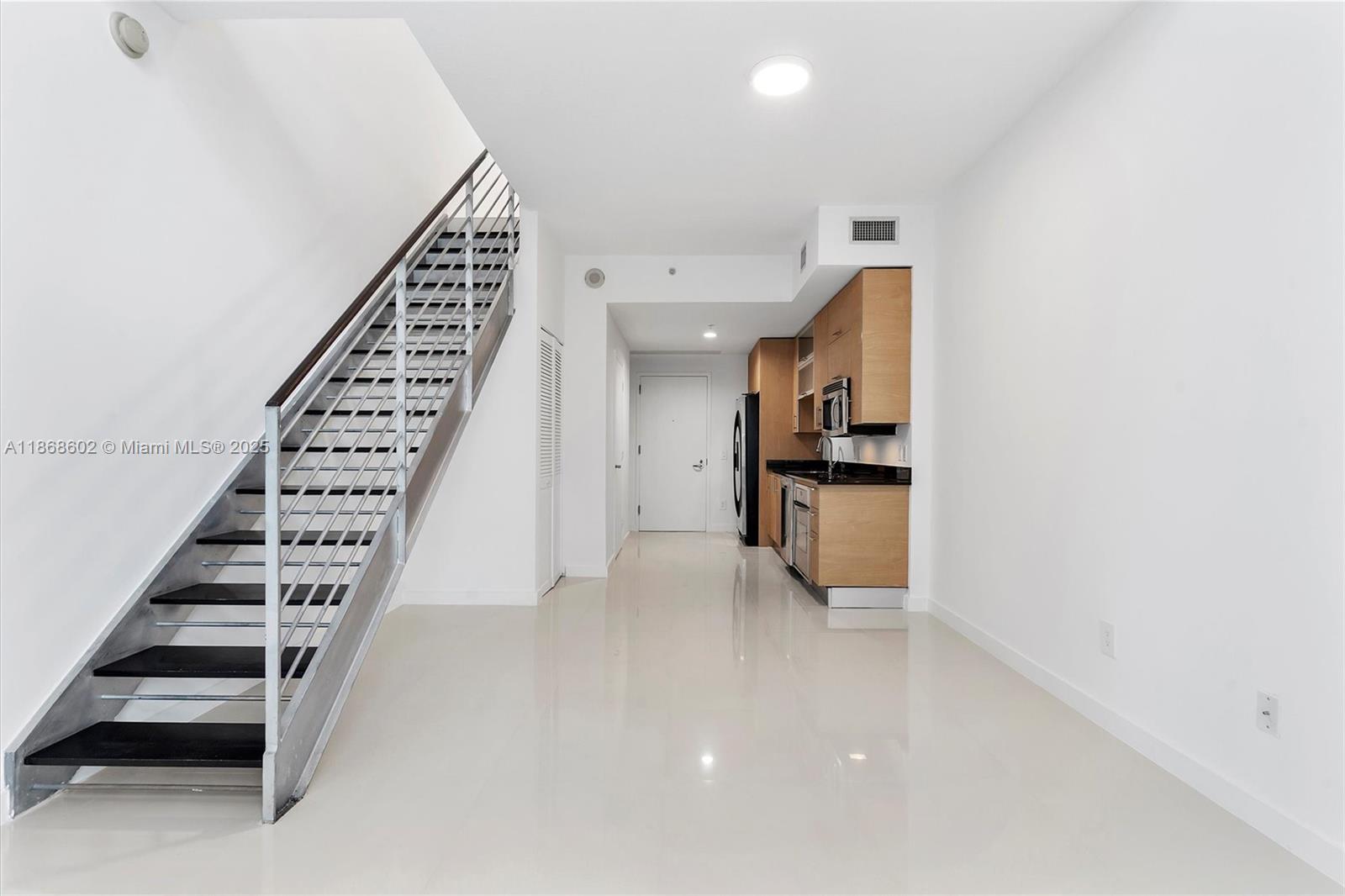 60 Southwest 13th Street, Unit 2420 Miami, FL 33130 - Photo 3 of 33 a view of an entryway with stairs