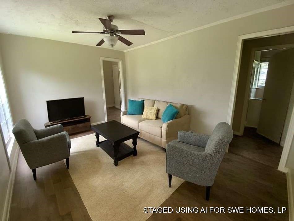4603 Keystone Street Houston, TX 77021 - Photo 13 of 13 a living room with furniture and a flat screen tv